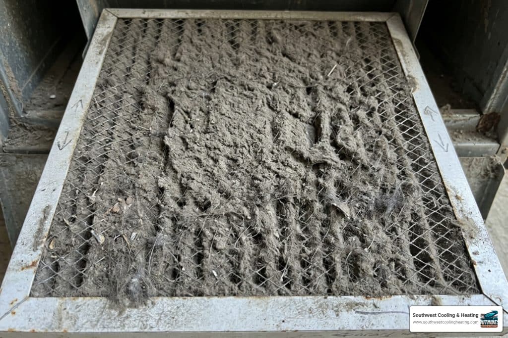 dusty clogged HVAC air filter close-up